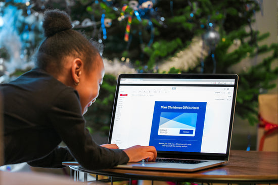 Email is still one of the most underutilized resources in small business marketing, and this is a picture of a child opening up an email on a laptop.