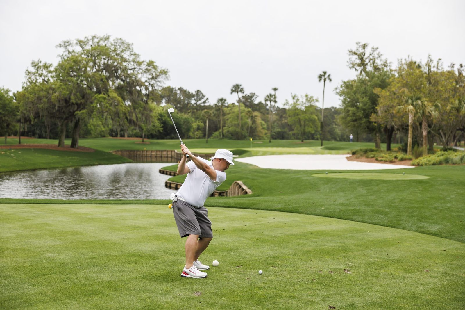 Tony hitting an approach shot at TPC Sawgrass
